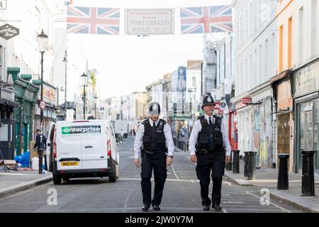 Notting Oil Carnival returns to London in 2022 the first time after a global pandemic.  Pictured: Police patrols the Notting Hill area early this morn Stock Photo