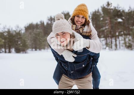 happy couple having fun in winter park Stock Photo