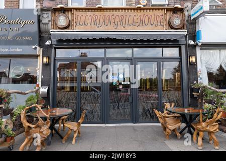 ALBANIANS Olti Bokciu, the owner of the Illyrian Grill House, an Albanian restaurant, Bounds Green, North London, UK Stock Photo