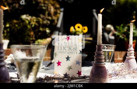 Best of luck at University greeting card on a dinner table Stock Photo