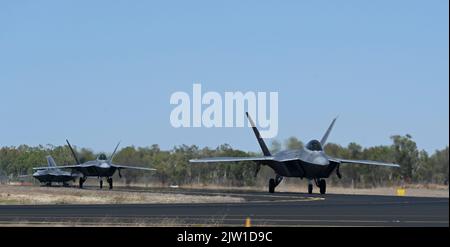 U.S. Air Force F-22 Raptors arrive at Royal Australian Air Force Base Tindal, Northern Territory, Australia, Aug. 25, 2022. Pacific Air Forces has an enduring commitment to a free and open Indo-Pacific across all domains. (U.S. Air Force photo by Senior Airman Adrian Salazar) Stock Photo
