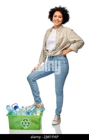 smiling woman sorting plastic waste Stock Photo