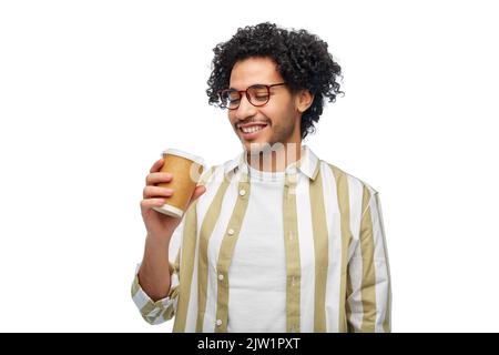 smiling young man with takeaway coffee cup Stock Photo