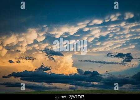 Mammatus clouds over a farm road in South Dakota, near Belle Fourche Stock Photo