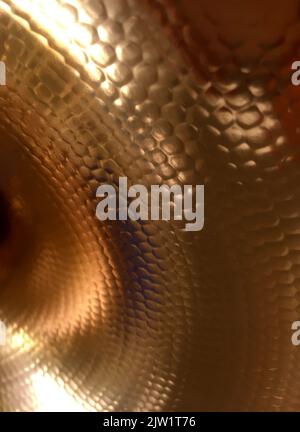 Hammered Copper Texture Background With Warm Golden Glow Stock Photo
