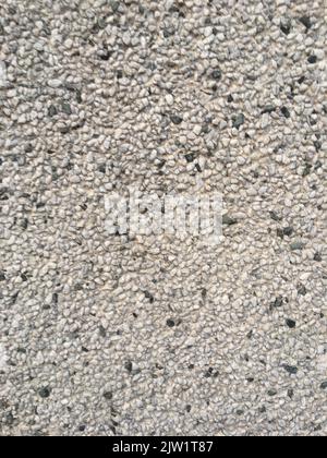 close-up of a wall covered with small stones Stock Photo