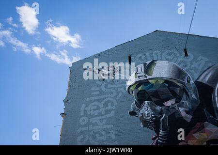 Kyiv, Ukraine. 30th Aug, 2022. Mural 'Ghost of Kyiv' dedicated to Ukrainian military pilots defending the skies of Ukraine from Russian aggression. The image shows a pilot in the cockpit of the famous MiG-29 aircraft. This is a collective image of all Ukrainian military pilots of the 40th tactical aviation brigade of the Ukrainian Air Force. Credit: SOPA Images Limited/Alamy Live News Stock Photo