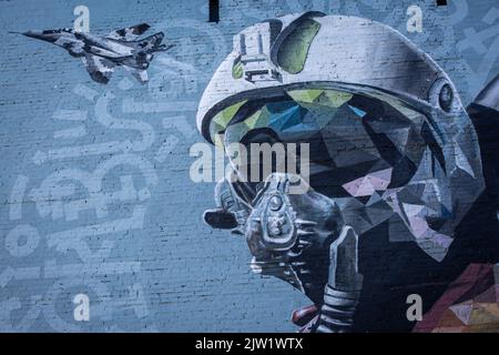 Kyiv, Ukraine. 30th Aug, 2022. Mural 'Ghost of Kyiv' dedicated to Ukrainian military pilots defending the skies of Ukraine from Russian aggression. The image shows a pilot in the cockpit of the famous MiG-29 aircraft. This is a collective image of all Ukrainian military pilots of the 40th tactical aviation brigade of the Ukrainian Air Force. Credit: SOPA Images Limited/Alamy Live News Stock Photo