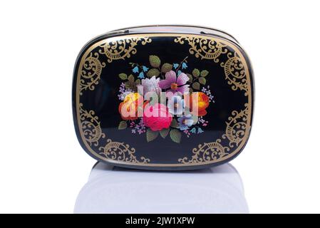 metal box with flowers pattern isolated on white background Stock Photo