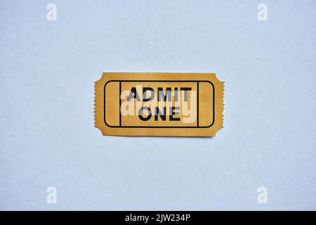 This is where the fun starts. a yellow movie ticket isolated on white. Stock Photo