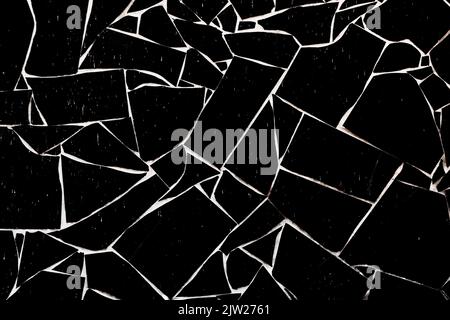 Black stone wall with velvet texture and white seams. Background of a brick fence. Stock Photo