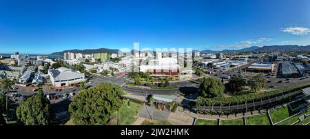 Aerial panorama of park and cityscape with mountains and perfect blue sky Stock Photo