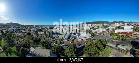 Aerial panorama of park and cityscape with mountains and perfect blue sky Stock Photo