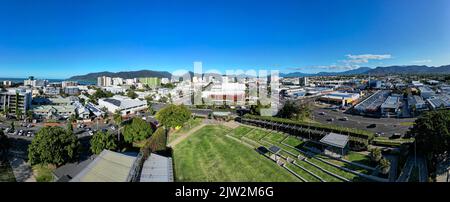 Aerial panorama of park and cityscape with mountains and peffect blue sky Stock Photo