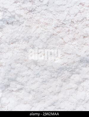 Full frame textured background of rough white mineral surface with crystals of salt Stock Photo