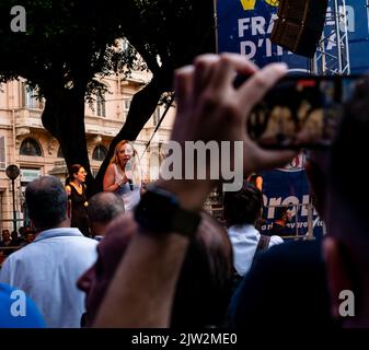 Cagliari, Sardinia, Italy: SEP 22 2022: Giorgia Meloni Fratelli D'Italia filmed from the crowd on the stage of the rally in cagliari discuss about new Stock Photo
