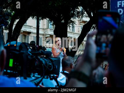 Cagliari, Sardinia, Italy: SEP 22 2022: Giorgia Meloni Fratelli D'Italia filmed from the crowd on the stage of the rally in cagliari discuss about new Stock Photo