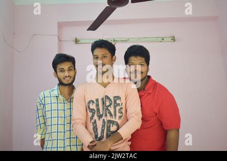 Group of three Indian men who are friends posing for photo. Stock Photo