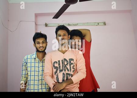 Group of three Indian men who are friends posing for photo. Stock Photo