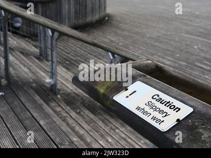 Wet Steps. Sign 'Caution Steps Slippery When Wet' Signage Stock Photo - Alamy