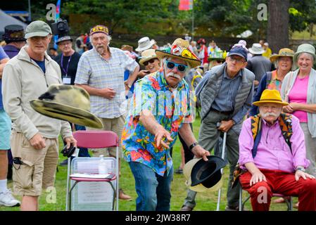 Bridport, Dorset, UK.  3rd September 2022.  Hat hurling at the Bridport Hat festival in Dorset  Picture Credit: Graham Hunt/Alamy Live News Stock Photo