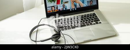 Online conference of colleagues through a laptop. Video call for training. Educational webinar chat between different people. Team meeting. Stock Photo