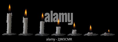 time lapse of burning wax candles isolated on black background, collection Stock Photo