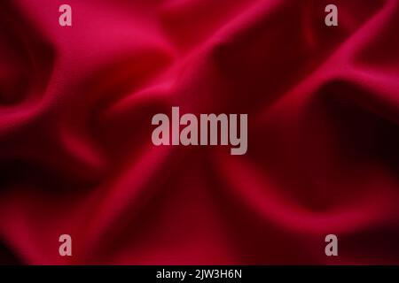Closeup wrinkled red jersey, soft fabric background. Stock Photo