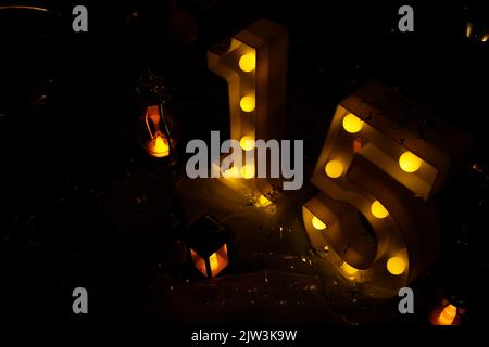 number fifteen with lights at 15th birthday party - top view - light party Stock Photo
