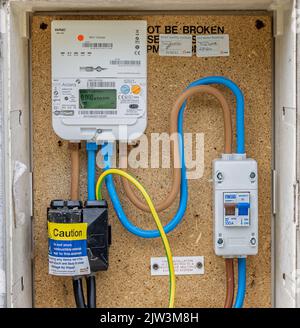 Close up of a smart electricty meter in wall mounted outside box in Chapmanslade, Wiltshire, UK on 3 September 2022 Stock Photo