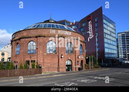 The Rotunda on the north side of the river repurposed as a restaurant and the new build Radisson Red hotel in Glasgow, Scotland. Stock Photo