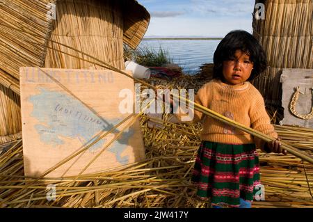 Uros Island, Lake Titicaca, peru, South America.   Climate change has lowered the level of Lake Titicaca, the highest navigable lake in the world, by Stock Photo