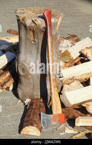 some Split firewood with ax and block Stock Photo