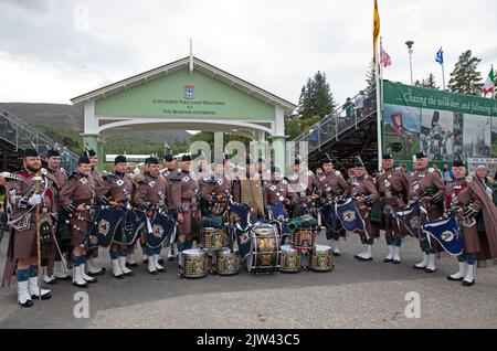 Braemar, Aberdeenshire Scotland, UK. 3rd September 2022. Braemar Royal Highland Gathering 2022. Mass Pipe Bands and highland games kept a capacity audience entertained on a dull day but dry. Stock Photo
