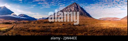 A panoramic view of Buachaille Etive Mor on a sunny morning Stock Photo