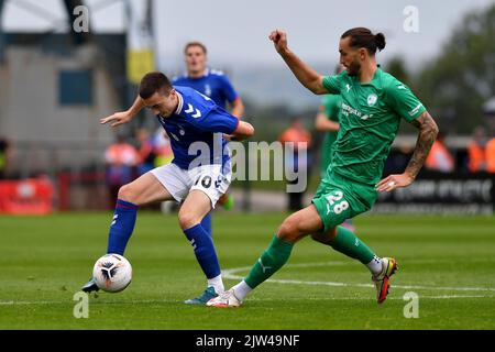 Luke Burgess of Oldham Athletic tussles with Oliver Banks of Chesterfield Football Club during the Vanarama National League match between Oldham Athletic and Chesterfield at Boundary Park, Oldham on Saturday 3rd September 2022. (Credit: Eddie Garvey | MI News) Credit: MI News & Sport /Alamy Live News Stock Photo