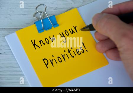 Know your priorities text written on yellow notepad. Priority concept. Stock Photo