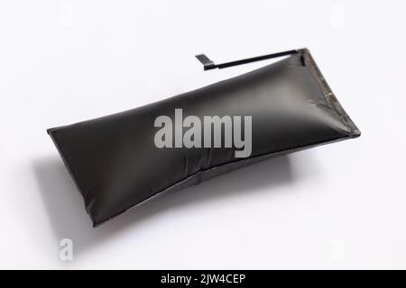Swollen smartphone battery. Damaged smartphone battery Stock Photo