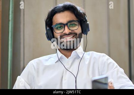Happy indian business man having hybrid call virtual meeting. Screen view Stock Photo