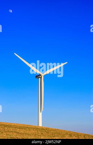 Wind turbine set against a clear blue winter sky Stock Photo - Alamy