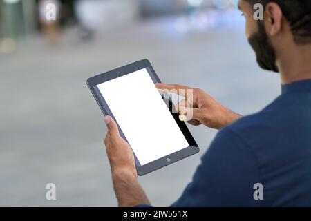 Business man using digital tablet with white screen mock up template in city. Stock Photo