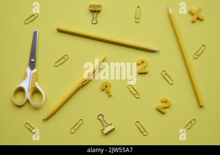 School stationery products on yellow background, flatlay. Back to school Stock Photo