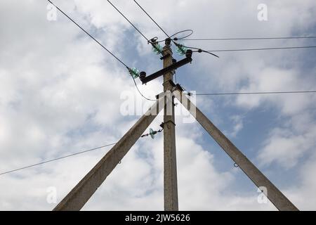 Electricity and lighting. Power line pylon in the countryside. Stock Photo