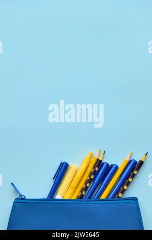 Case with school stationery supplies on grey background, flatlay. Back to school Stock Photo