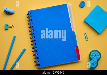 School stationery products on yellow background, flatlay. Back to school Stock Photo