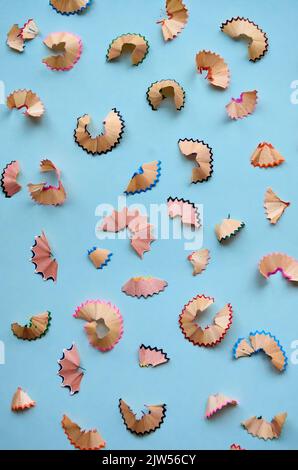 Many color pencils peels pattern isolated on white background, flatlay. Stock Photo