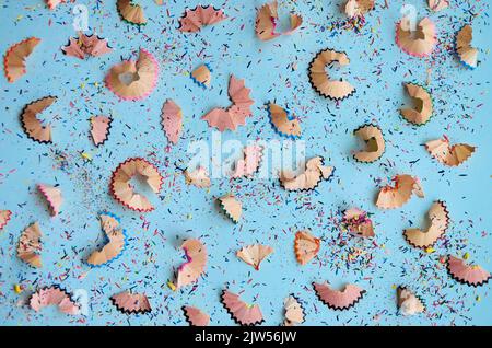 Many color pencils multicolored peels pattern on white background, flatlay. Stock Photo
