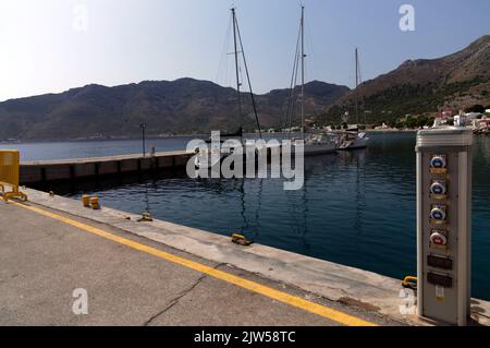 Livadia harbourside with boat services. Tilos island, Dodecanese, Greece, EU Stock Photo