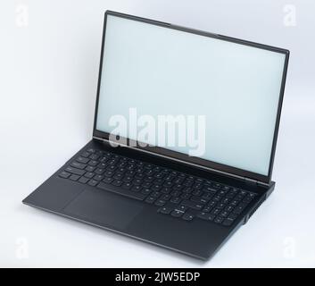 Black color laptop isometric view with open clean screen isolated and full keyboard Stock Photo