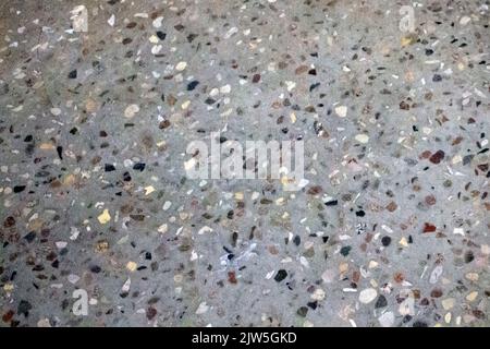 Grey old wall texture with small stones for a background. Stock Photo